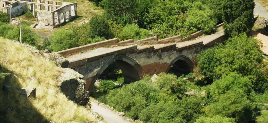 Ashtarak Old Bridge between the green slopes of Kasagh Gorge
