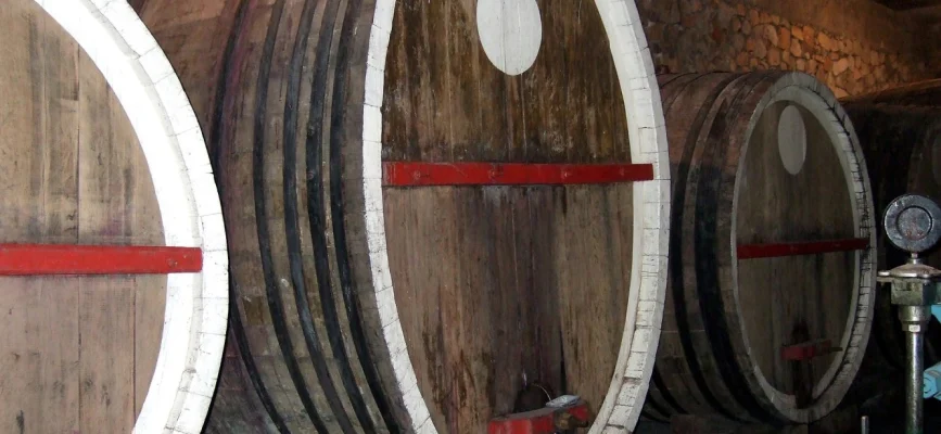 Large wooden barrels in the cellar of Hin Areni Winery