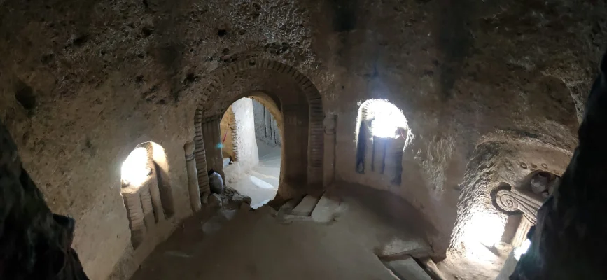 Hand-carved central hall of Levon’s Divine Underground with arches and steps