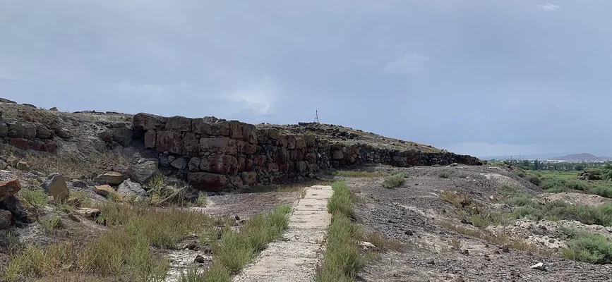 Excavated stone walls and archaeological layers at Metsamor