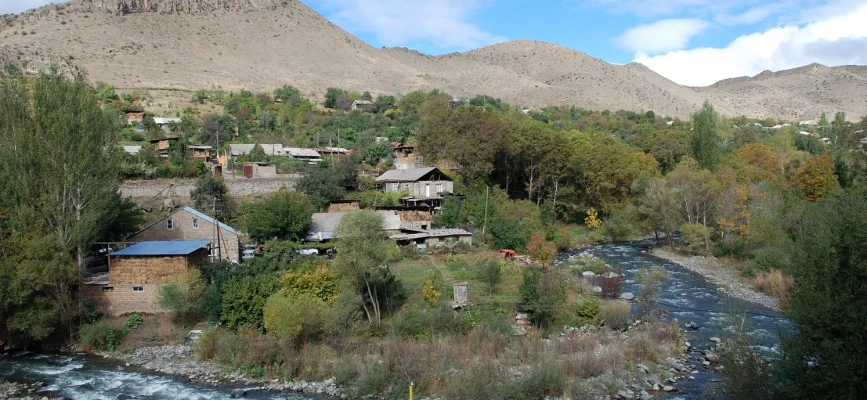 Homes of Shatin beside the green banks of the Yeghegis River and rocky slopes